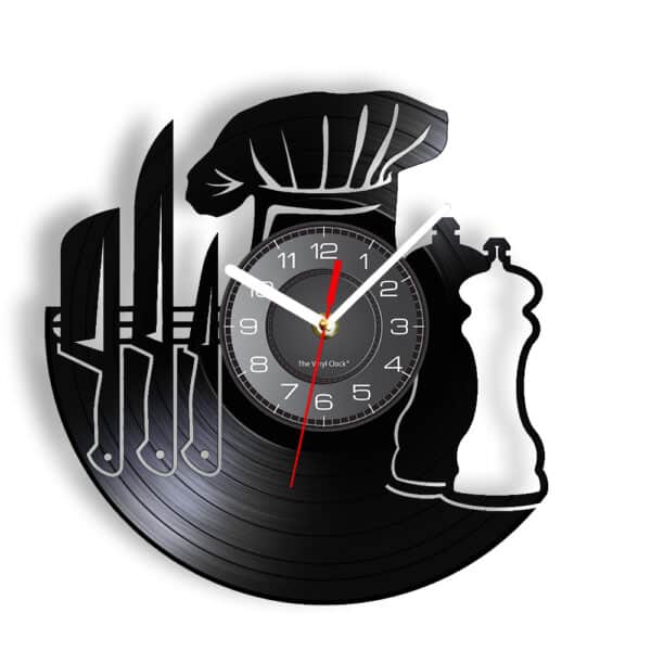 Horloge murale en vinyle, design de cuisinier, de couleur noir, avec un chapeau de cuisinier en haut et sur le côté des couteaux et au centre l'horloge ronde