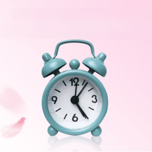 Horloge Réveil Électronique Mignonne en Métal sur fond rose